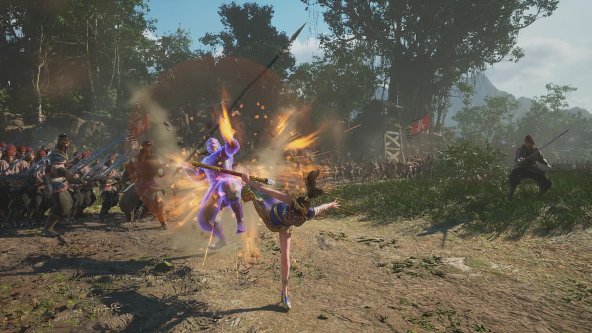 A warrior in blue and gold kicks an enemy amid a burst of orange sparks as soldiers clash in a forest battlefield in DYNASTY WARRIORS 3: Complete Edition Remastered.